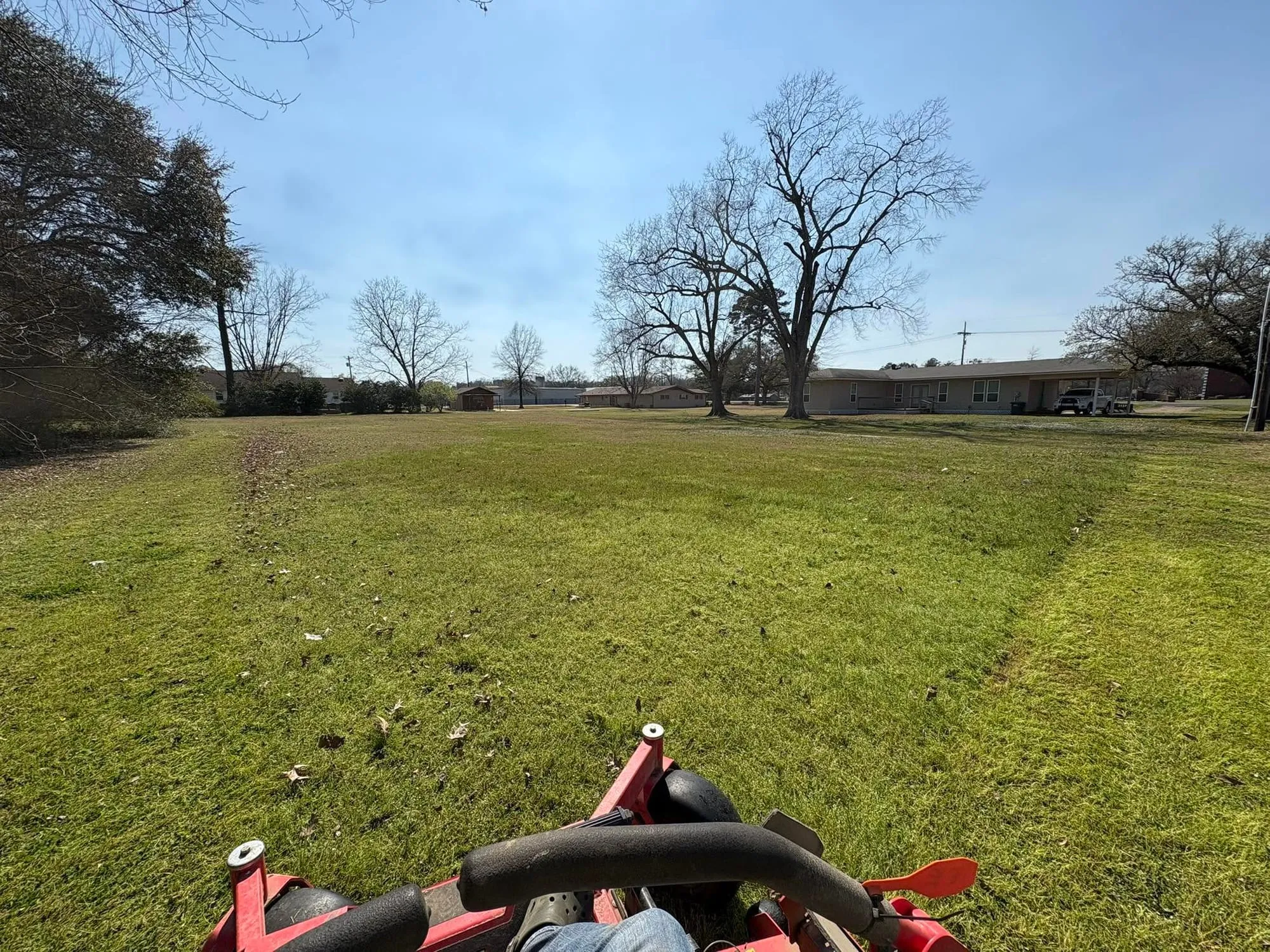 Large residential lawn being mowed from a zero-turn mower in Franklin Parish, Louisiana