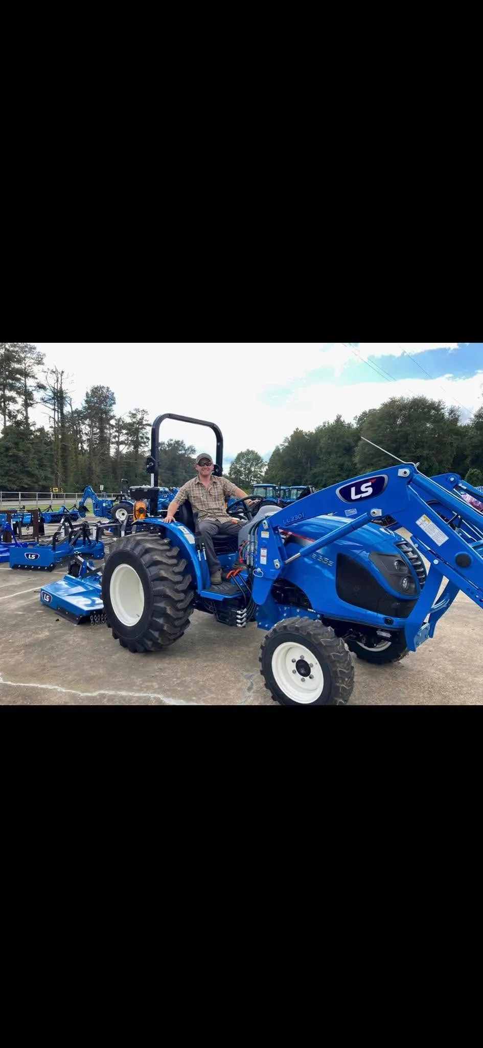 LS tractor and rotary cutter used to prep ground for gardens and food plots